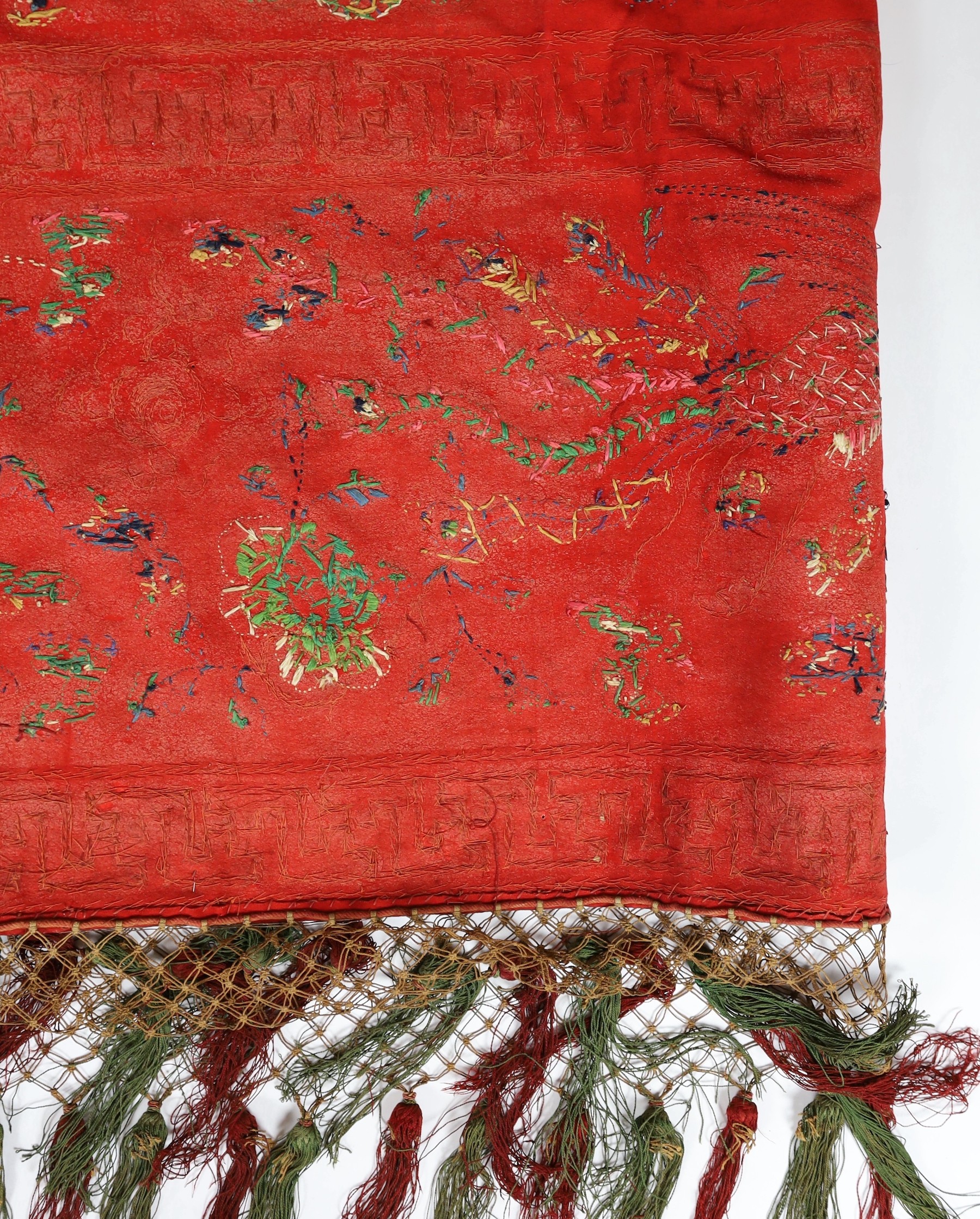 A Chinese embroidered silk ‘dragon, phoenix and lion’ panel or table frontal, late Qing dynasty, 117cm x 337cm